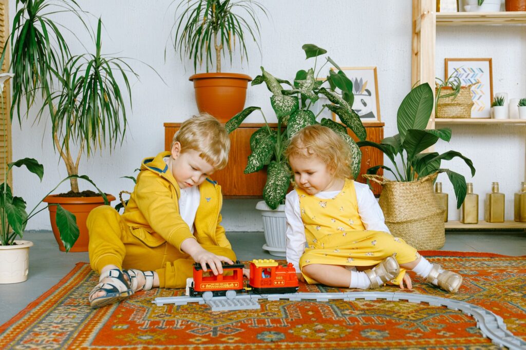 kids playing with a toy train